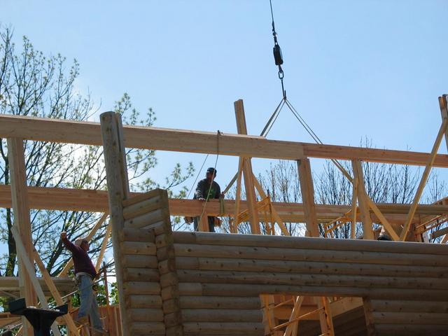 Boomtruck setting glulam beams.