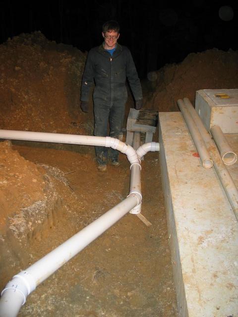 4 downspouts collect into single pipe to cistern.