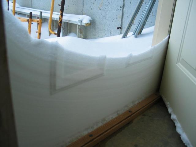 Snow drift against the door.